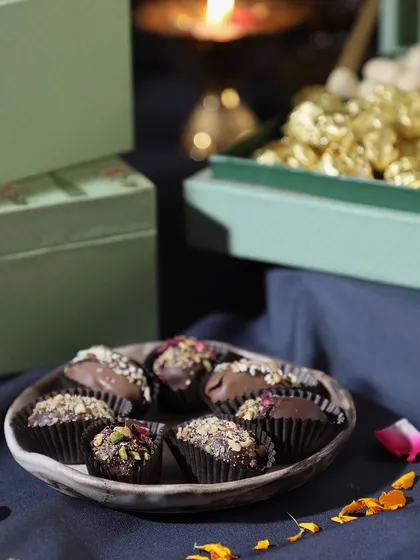 A close-up of our luxury chocolate dates and truffles, beautifully arranged for one of our Diwali gift boxes.