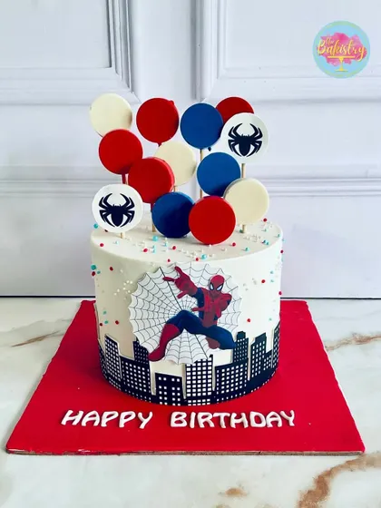 Swing into a superhero adventure with this amazing Spider-Man cake, featuring the web-slinger against a city skyline.