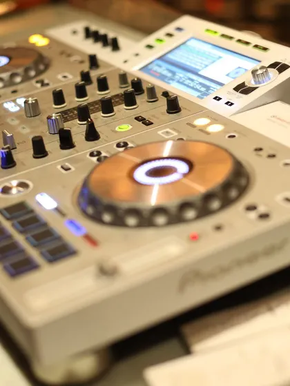 A close-up of the Pioneer DJ console, capturing the tools of the trade that set the musical vibe for a great party.