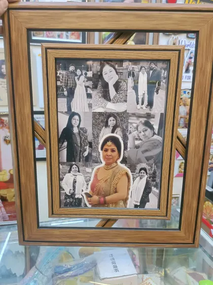 This is another example of our double-layer mosaic frame. The main photo is in color, which makes it stand out beautifully against the black and white collage of memories behind it.