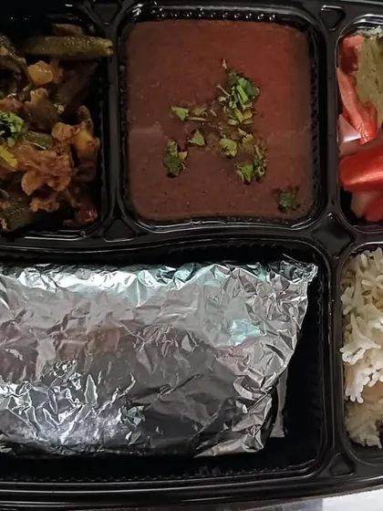 A tasty thali with black chana masala and masala bhindi. A great combination of flavors and textures.