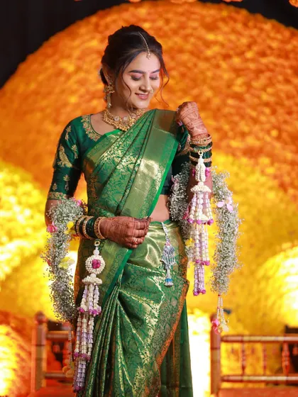 The bride admiring her fresh floral kalire. We take great care to ensure each piece is perfectly crafted and delivered fresh for the event.