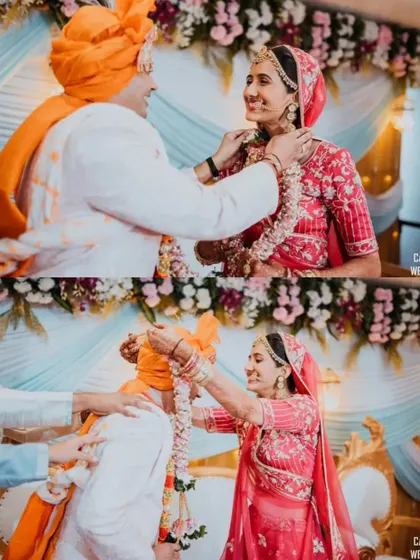 The fun and games of the Varmala ceremony, with the bride and groom playfully trying to garland each other.