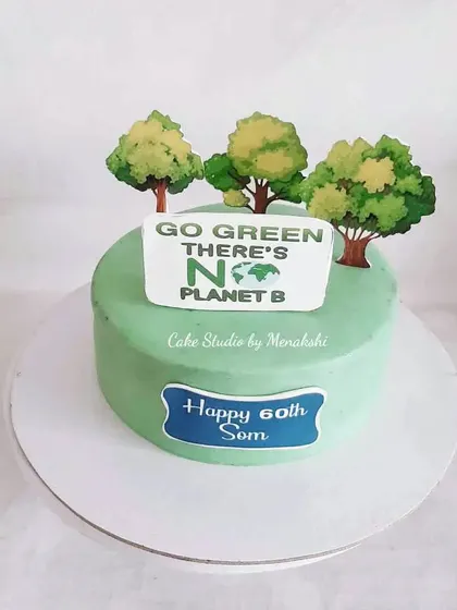 A 60th birthday cake for an environmentalist with the message "Go Green, There's No Planet B."