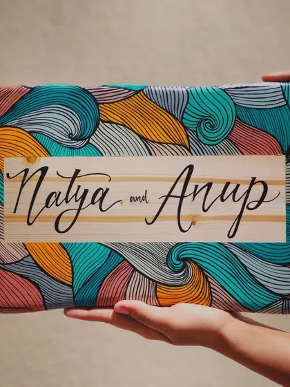 A duplicate of 167, we love how this boho-inspired name plaque for "Natya and Anup" turned out. The natural wood grain contrasts beautifully with the colorful, intricate line art.
