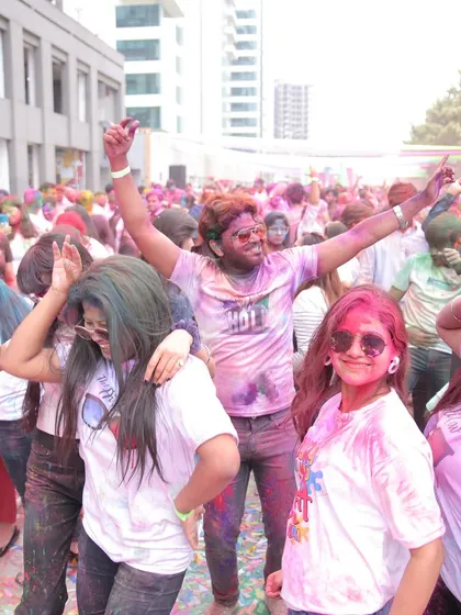 The energy of the dance floor at a corporate Holi party. Employees are seen dancing and enjoying themselves, showcasing the lively entertainment and atmosphere we curate.