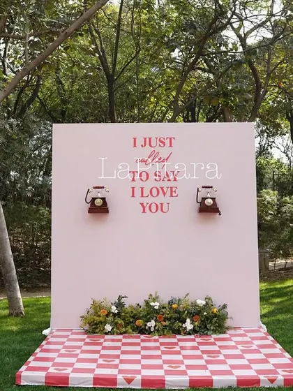 For a Valentine's picnic brunch, we created this quirky and romantic photo wall. The pink backdrop with vintage telephones and the phrase "I just called to say I love you" made for a fun and interactive photo opportunity.