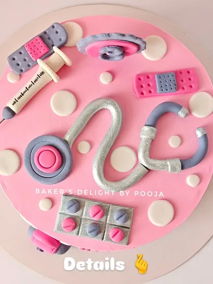 A top-down view showcasing the detailed fondant work on the doctor cake. Each element, including the band-aids and medicine pack, was carefully handcrafted to match the theme.