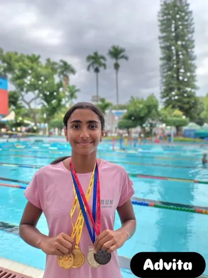 Advita with her gold, silver, and bronze medals.