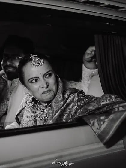The bride's emotional face as she looks out of the car window during the Vidaai.