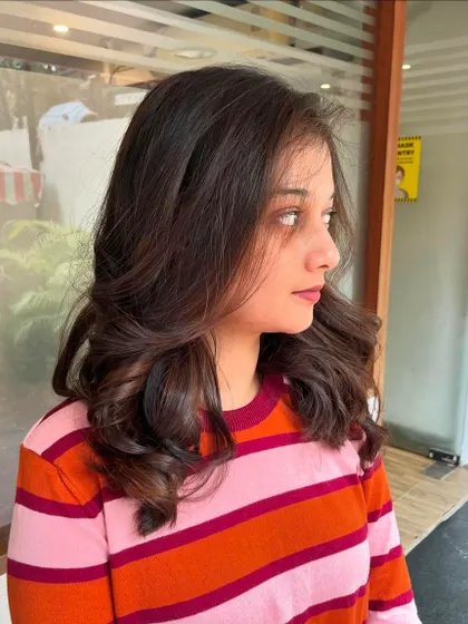 A side view of the natural balayage highlights.