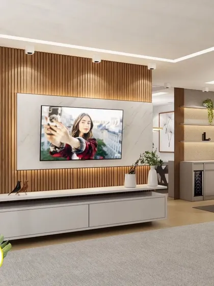 A living room TV unit that combines a marble-finish panel with wood fluting, showcasing a popular and contemporary design trend.