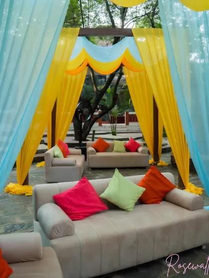 Inside one of the cabanas, plush sofas with colorful cushions provided a comfortable and inviting lounge spot for guests.