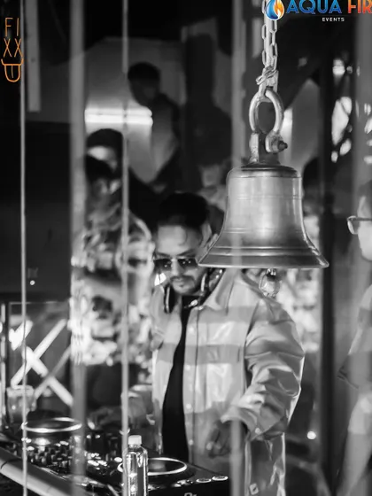 Another perspective of me at the console, captured in black and white. It highlights the focus and intensity required to control the music.