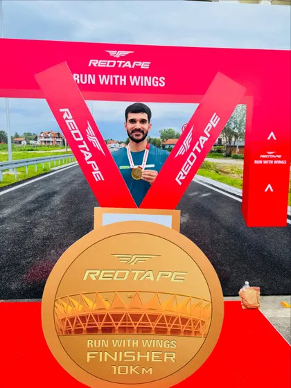 Proudly holding my finisher's medal. Every achievement, big or small, is a step forward on the fitness journey.