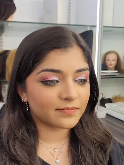 Another view of the pink semi cut crease, showing how it looks from a slight angle. The smooth blending and clean lines are key to this glamorous eye makeup.
