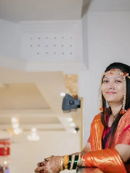 A simple and happy portrait of the bride, her genuine smile being the main focus.
