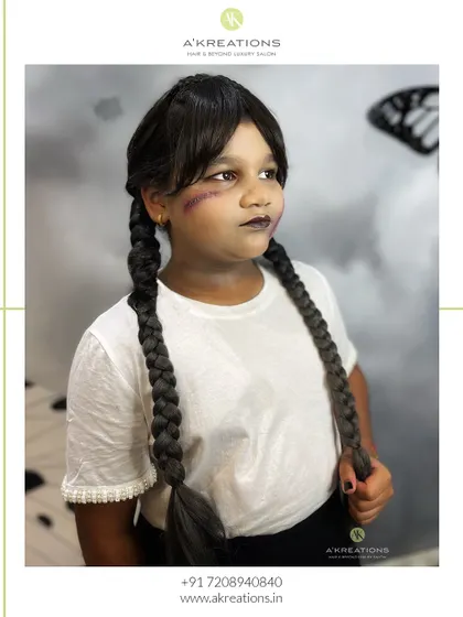 This young client is ready for trick-or-treating with her complete Wednesday Addams hair and makeup look.
