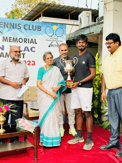 A duplicate shot capturing the formal prize giving ceremony at the Trivandrum Tennis Club.