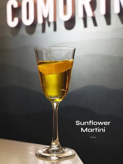 The Sunflower Martini, a bright and floral martini with a beautiful golden hue.