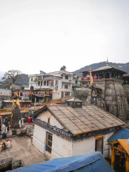 An establishing shot of the temple complex, showing the entire village setup and the preparations for the divine wedding ceremony.