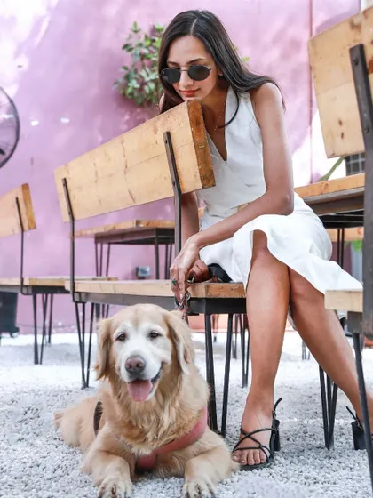 A stylish shot of Anjana and Abby at a pet friendly cafe, showing that we can have our photoshoot at your favorite local spots.