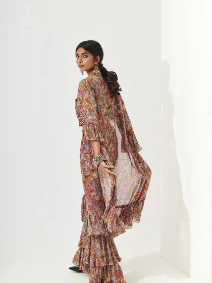 This look for Shopverb features a soft, natural makeup style that complements the bohemian feel of the ruffled ethnic wear. The makeup is designed to look effortless and fresh.