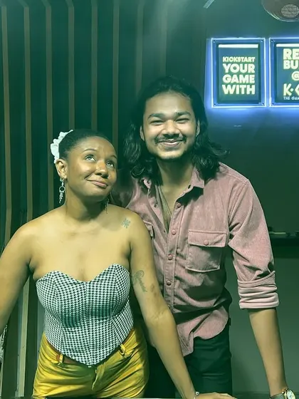 A couple enjoying the vibe during our Holi karaoke celebration. It's a great place for a fun and unique date night.