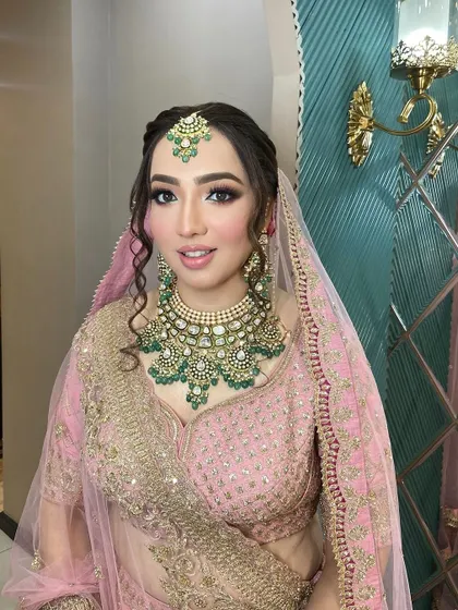 A sweet bride ready for her big day. We gave her a soft, sweet pink touch on the eyes to complement her beautiful pink lehenga.