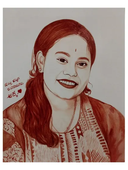 A blood portrait of a smiling woman with a personal message written in Kannada, making it a heartfelt gift.