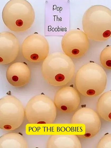 A cheeky and playful game idea for a bachelorette party or bridal shower, "Pop the Boobies" is sure to get everyone laughing.