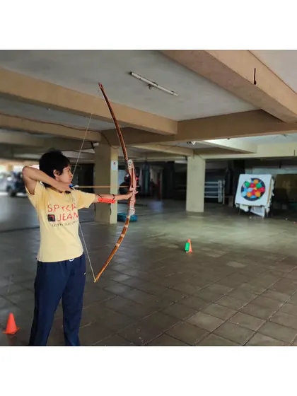 A student practices her form at our indoor range. This setup allows us to train year-round, regardless of the weather.