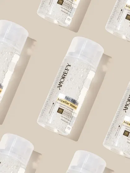 A creative pattern shot of micellar water bottles. Repetitive patterns are visually striking and work well for social media banners and backgrounds.