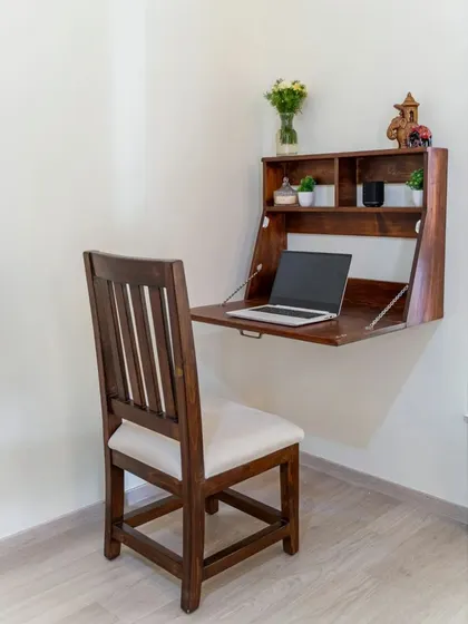 A duplicate of image 231, demonstrating the functionality of the wall-mounted desk.