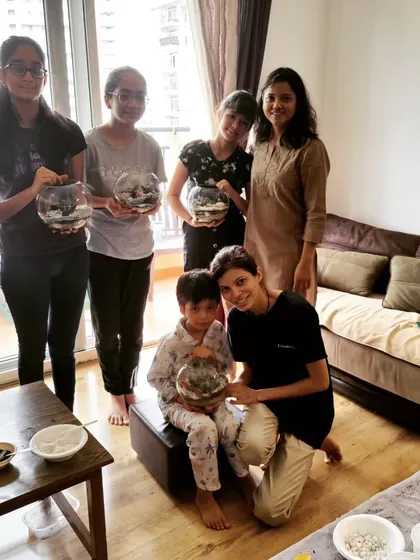A group of kids and their parents after a successful terrarium workshop at home. I can bring the entire experience to your apartment or house for a private session.