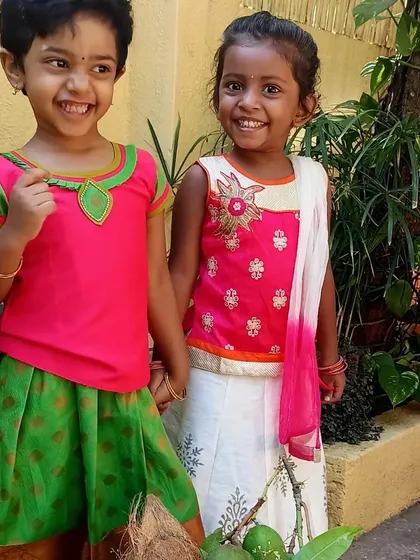 A candid shot of two friends enjoying the Ugadi festivities.