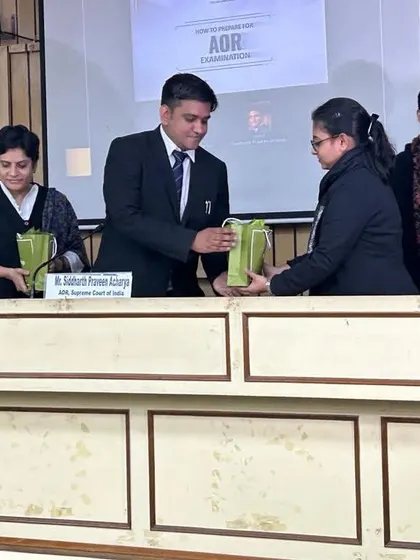 Receiving a token of appreciation after the panel discussion at the Indian Law Institute.