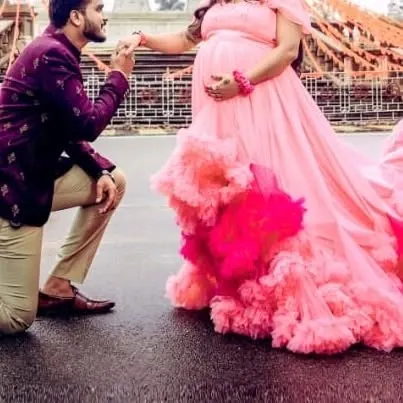 A romantic pose from a maternity shoot. The client is wearing my pink ruffled gown, a popular choice that makes every mom-to-be feel like a princess.