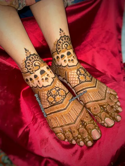 Another angle of this stunning bridal foot henna, showing the detail in the peacock and bell motifs.