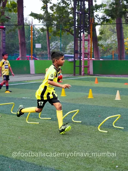 This action shot captures a player mid-stride during a hurdle drill. I focus on developing quick feet and explosive movements that translate directly into better on-field performance.