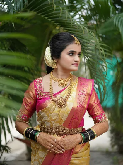 A three quarter view of the bride, looking elegant and poised. The makeup is designed to photograph beautifully from all angles.