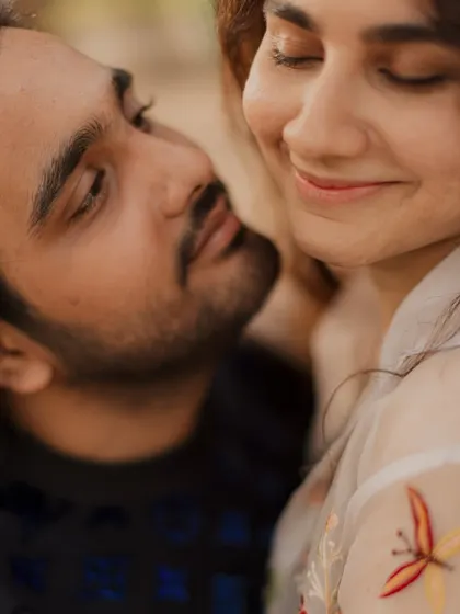 A close-up capturing a genuine smile and a look of pure adoration. These are the authentic, heartfelt moments we aim to preserve.