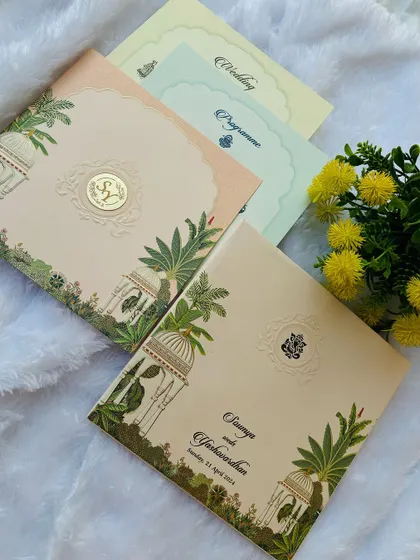 This destination wedding invitation features beautiful illustrations of palace architecture and lush greenery, setting the theme for a royal celebration.