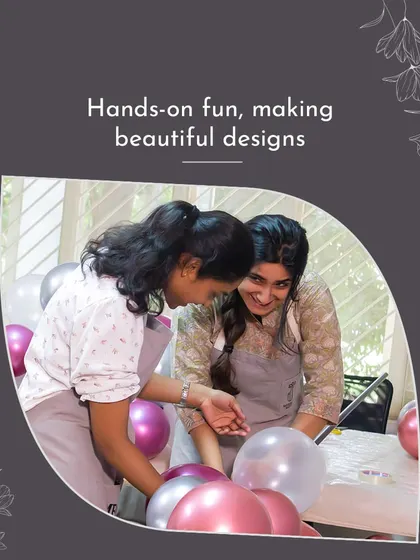 Two students share a laugh while working on their project. This shows the hands-on fun and supportive community that is a hallmark of the MMDS experience.