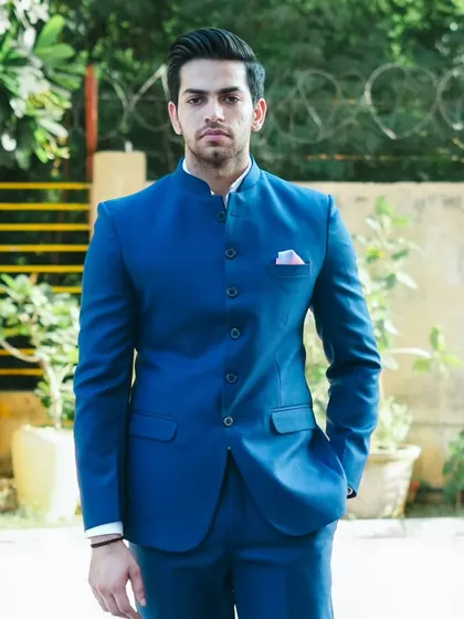 The sharp cut and fit of our Jodhpuri suit is evident in this photo. Quality tailoring is my promise.