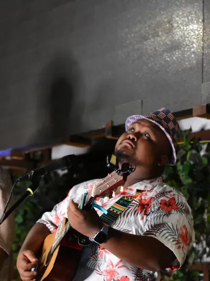 Lost in a dream that just came to me. A candid moment during a soulful acoustic performance, completely absorbed in the music.