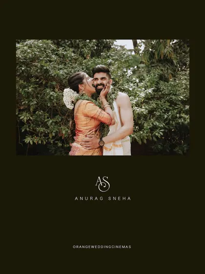 A beautiful portrait of a couple, with the bride kissing the groom's cheek, framed with their initials.