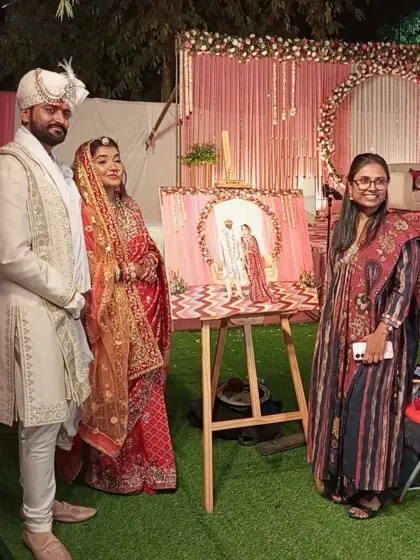 The couple seeing their finished portrait for the first time at their wedding in Civil Lines. Capturing their joy is the ultimate reward for my work.