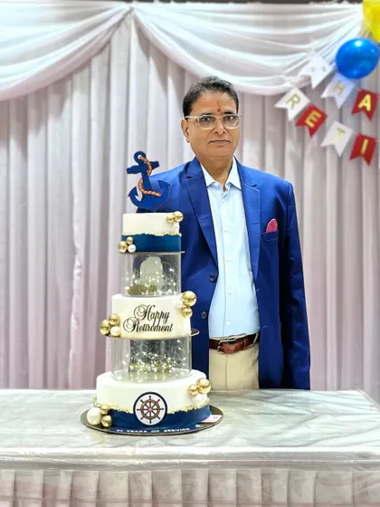 The gentleman celebrating his retirement with our custom Navy-themed cake.