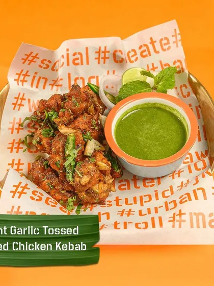 My Burnt Garlic Tossed Spiced Chicken Kebab is a flavour explosion. Crispy chicken kebabs are tossed with burnt garlic and spices, served with a fresh mint chutney.